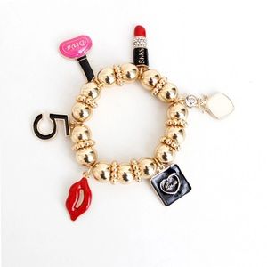 Trendy designer style gold ball charm bracelet